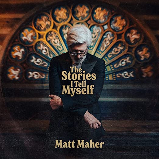 Album cover of 'The Stories I Tell Myself' by Matt Maher featuring the artist in a contemplative pose with a piano in the background.